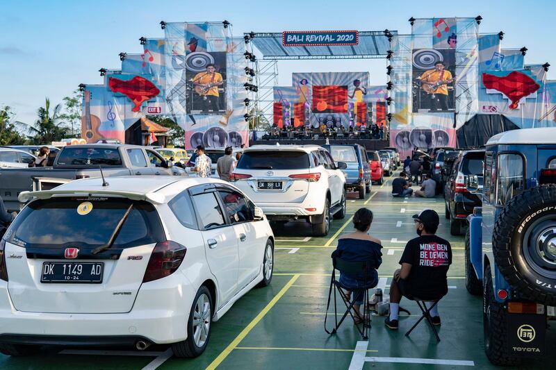 People watch a drive-in music concert amid the coronavirus pandemic in Ubud, Bali, Indonesia. Bali has reopened to domestic tourists and the government has hinted at the possibility of opening to international travelers in September.  EPA