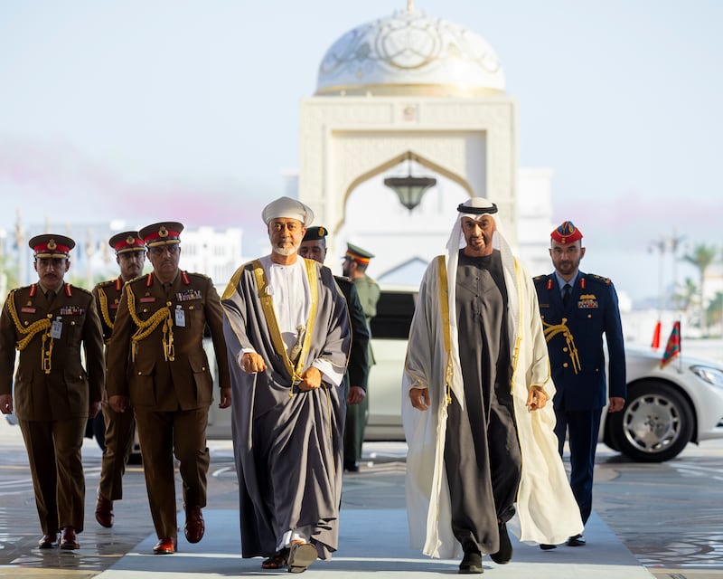 Sheikh Mohamed escorts Sultan Haitham to the state reception at Qasr Al Watan