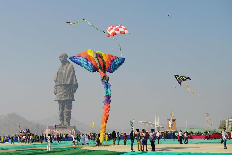 Indian and foreign participants fly kites during the 30th International Kite Festival.  AFP