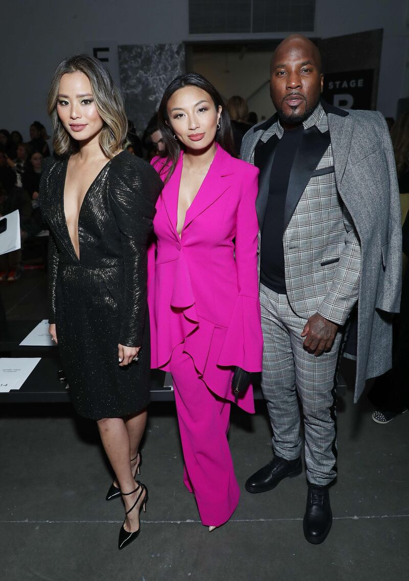 Jamie Chung, Jeannie Mai, and Jeezy attend the Pamella Roland show during New York Fashion Week on February 7, 2020, in Los Angeles. AFP