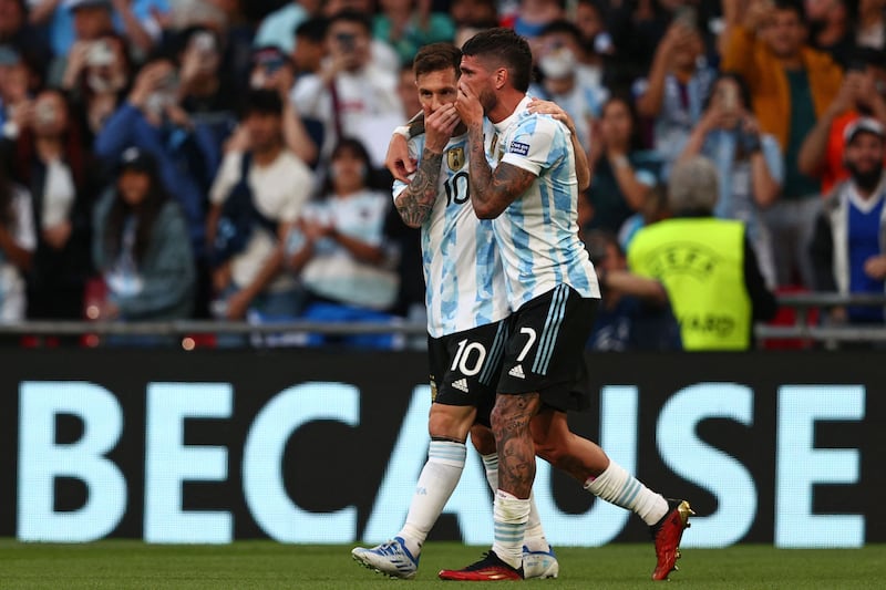 Argentina's Lionel Messi and Rodrigo De Paul celebrate after taking the lead. AFP