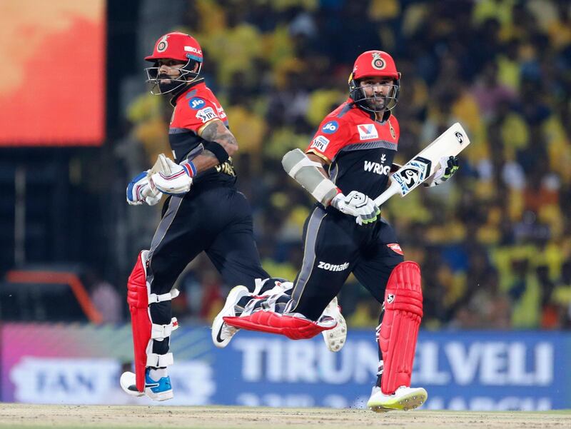 Royal Challengers Bangalore captain Virat Kohli, left, and Parthiv Patel run between the wickets to score during the VIVO IPL T20 cricket match between Chennai Super Kings and Royal Challengers Bangalore in Chennai, India. AP Photo