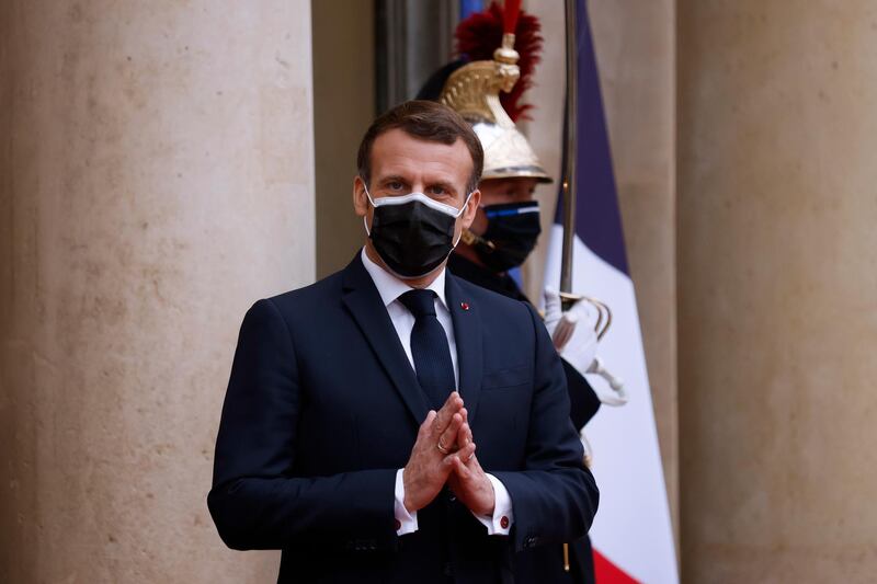 French President Emmanuel Macron waits to receive Egyptian President Abdel Fattah El Sisi at the Elysee Palace in Paris on December 7, 2020.  EPA