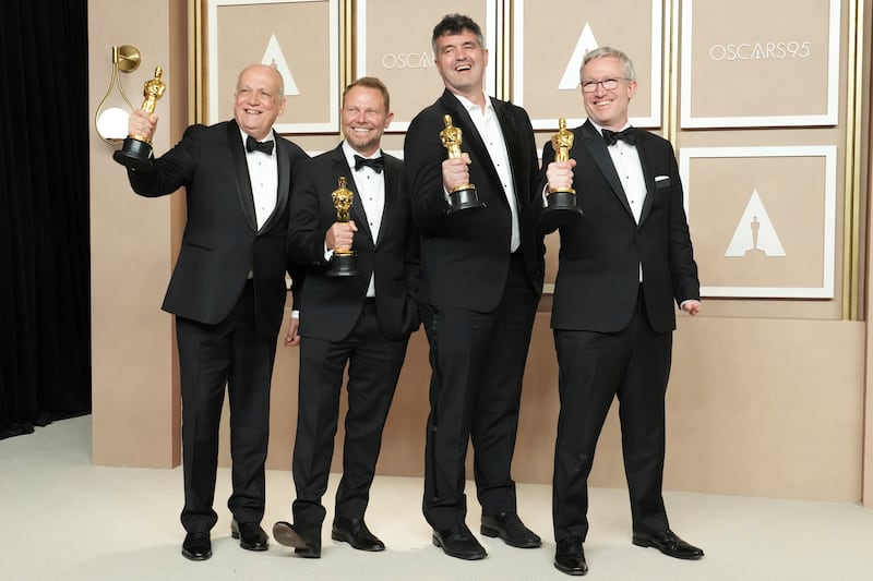 From left, Joe Letteri, Richard Baneham, Eric Saindon and Daniel Barrett, winners of the award for Best Visual Effects for Avatar: The Way of Water. AP