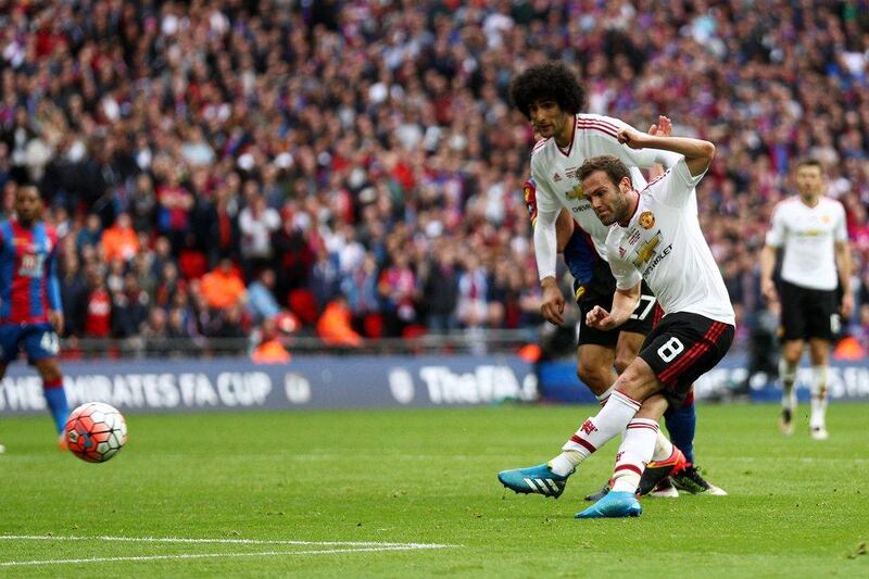 Juan Mata of Manchester United (8) scores their first goal during the FA Cup Final match between Manchester United and Crystal Palace at Wembley Stadium on May 21, 2016 in London, England. (Paul Gilham/Getty Images)