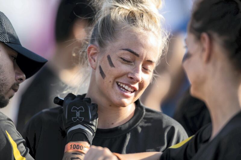 DUBAI, UNITED ARAB EMIRATES - DECEMBER 7, 2018. 

A woman gets her face painted before partaking in the Tough Mudder challenge in Hamdan Sports Complex.

du Tough Mudder is a mud and obstacle course designed to test participant's physical strength, stamina, and mental grit. It is a team-oriented challenge with no winners, finisher medals, or clocks to race against. 

(Photo by Reem Mohammed/The National)

Reporter:
Section:  NA