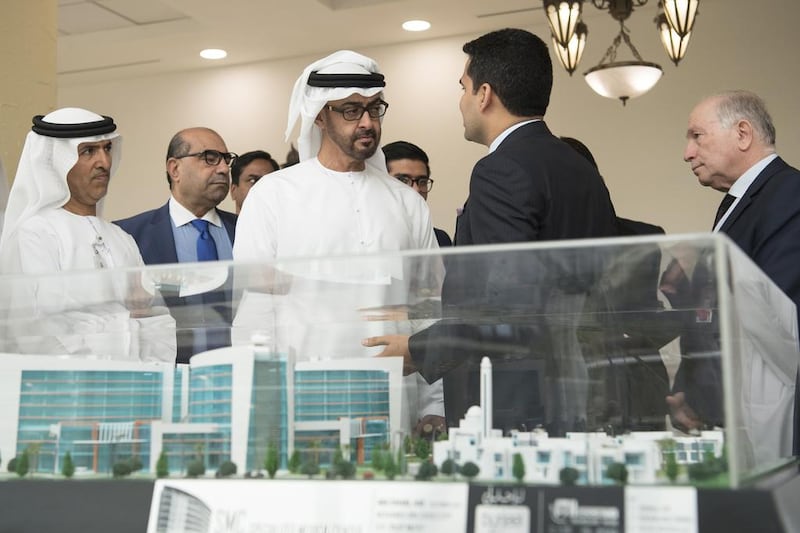 Sheikh Mohammed bin Zayed, Crown Prince of Abu Dhabi and Deputy Supreme Commander of the Armed Forces, at Burjeel Hospital with Dr Shamsheer Vayalil, managing director of VPS Healthcare, who gave him an update on Burjeel Medical City. The Dh1.2bn hospital will open in the city next year. With them is Dr Mugheer Al Khaili, Chairman of the Health Authority Abu Dhabi.  Hamad Al Kaabi / Crown Prince Court – Abu Dhabi
