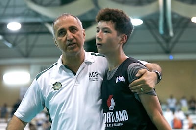 Volunteer coach Levent Edepli with one of the basketball players he mentored for Jr NBA Abu Dhabi. Photo: sport360 / DCT Abu Dhabi 