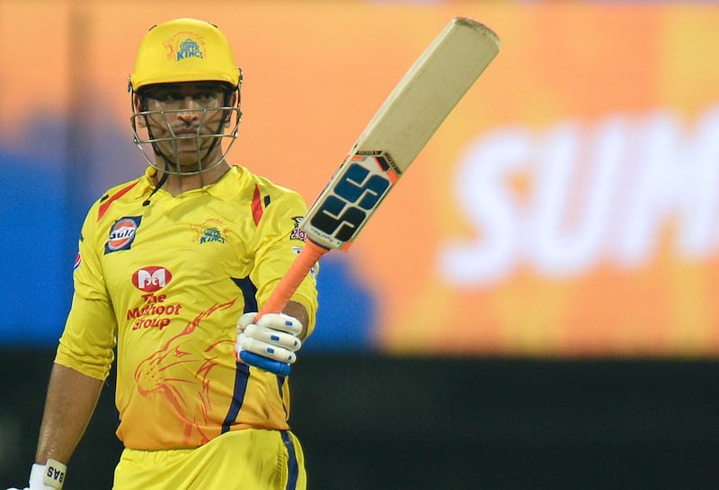 Chennai Super Kings cricket captain Mahendra Singh Dhoni raises his bat as he celebrates after scoring a fifty (50) runs during the 2019 Indian Premier League (IPL) Twenty20 cricket match between Chennai Super Kings and Rajasthan Royals at the M.A. Chidambaram Stadium in Chennai on March 31, 2019. (Photo by ARUN SANKAR / AFP) / ----IMAGE RESTRICTED TO EDITORIAL USE - STRICTLY NO COMMERCIAL USE-----