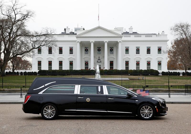 The hearse passes by the White House from the Capitol. Reuters
