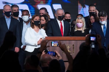 JERUSALEM, ISRAEL - MARCH 24: Israeli Prime Minster Benjamin Netanyahu, his wife Sara Netanyahu and Likud party members greet supporters in the Likud party after vote event on March 24, 2021 in Jerusalem, Israel. In this election, the fourth in a two-year period, Yair Lapid emerged as the principal anti-Netanyahu figure. One potential outcome of today's vote is that neither Lapid nor Netanyahu can form a government, leading to yet another election. (Photo by Amir Levy/Getty Images)