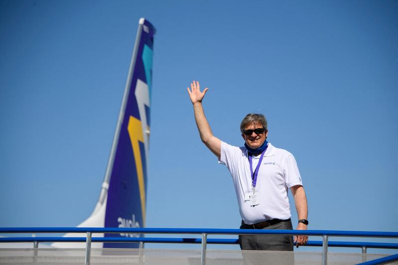 Andrew Levy, chairman and chief executive officer of Avelo Airlines, waves as he boards the inaugural flight. AFP