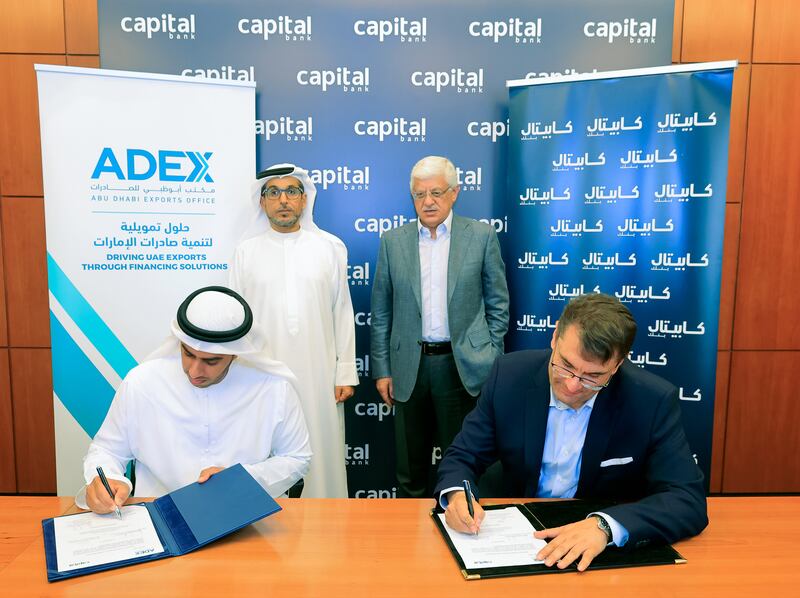 Khalil Al Mansoori, acting director general of the Abu Dhabi Exports Office, and Capital Bank Group chief executive Daoud Al Ghoul sign the agreement in Jordan. Photo: Adex