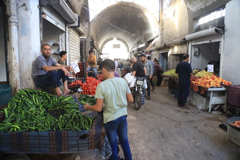 The crowd in a vegetable market in Idlib without taking precautions against Covid-19, such as face masks or social distancing. Abd Almajed Alkarh for The National