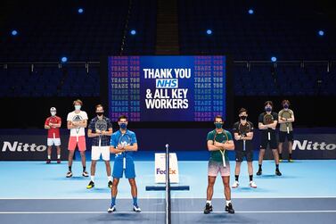 LONDON, ENGLAND - NOVEMBER 13: In this handout picture provided by ATP 2020 Nitto ATP Finals singles qualifiers from left to right: (L-R) Diego Schwartzman of Argentina, Alexander Zverev of Germany, Daniil Medvedev of Russia, Novak Djokovic of Serbia, Rafael Nadal of Spain, Dominic Thiem of Austria, Stefanos Tsitsipas of Greece and Andrey Rublev of Russia pose for a photo in front of a message saying 'Thank You NHS and All Key Workers' at The O2 Arena during previews for the Nitto ATP Finals at The O2 Arena on November 13, 2020 in London, England. (Photo by Wonderhatch/ATP via Getty Images)
