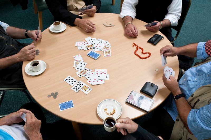 Shortlisted: 'Cards and coffee' by Erdal Redjep. Shot as part of the project 'Heartland', this shot shows a group of elderly Turkish Cypriot men around a table at a community centre to play their regular afternoon game of cards and to drink Turkish coffee.