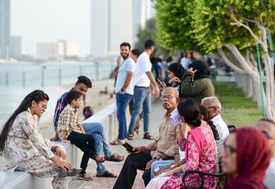 Families gather at the Corniche in Abu Dhabi during this year's Eid Al Adha holidays. Khushnum Bhandari / The National