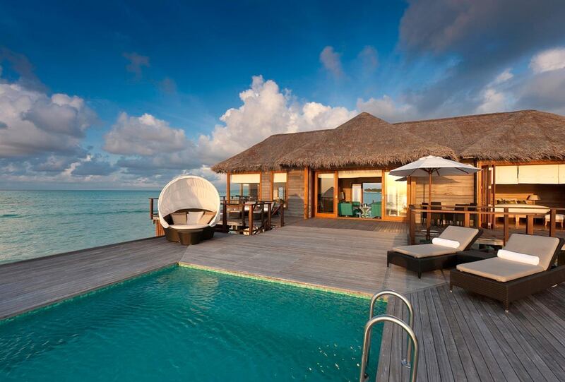 A sunset water villa at Conrad Maldives Rangali Island. Conrad Maldives