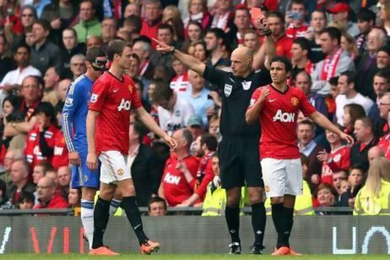 Rafael da Silva, right, sees red for kicking out at Chelsea's David Luiz.