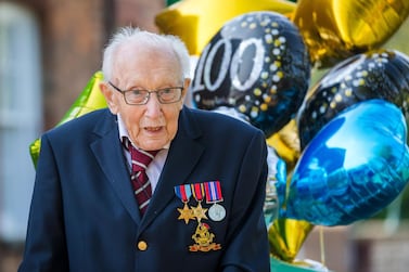 99-year-old British veteran Captain Tom Moore outside his house after completing the 100th length of his back garden in Marston Moretaine, Bedfordshire, Britain, 16 April, 2020.  EPA
