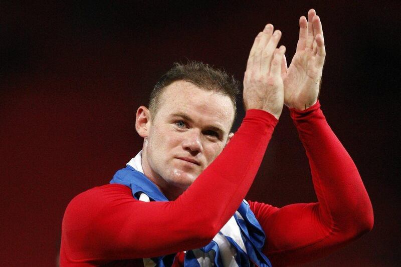 Alex Ferguson has walked back a claim that Wayne Rooney asked for a transfer in May.  Jon Super / AP
