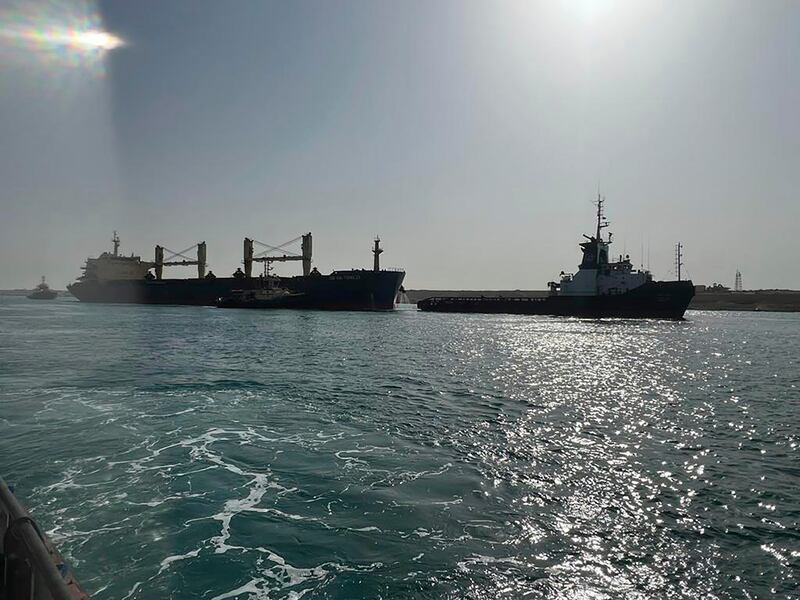 Tugs tow the Xin Hai Tong 23 after it ran aground on the Suez Canal in May. In the latest incident, a ship hit a bridge on the waterway on Wednesday. AP
