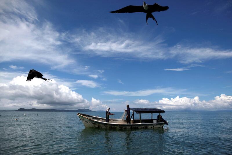 epaselect epa08829492 Two men prepare a net to fish in the port of Palo Seco, in the Gulf of Montijo in Mariato, Veraguas, Panama, 13 November 2020 (issued 19 November 2020). In the Palo Seco port, in the Pacific Ocean, located in the Panamanian province of Veraguas and a five-hour drive from Panama City, the locals celebrate a slow lifestyle determined by fishing. Fishermen start their day early in the morning when the sun rises while some of them have been there since the night before. Once the fisherman are back from fishing the port of Palo Seco is getting busy with unloading the catch, cleaning the fish and preparing it for sale. After some rush hours the port is going back to a quiet time in between another fishing.  EPA-EFE/BIENVENIDO VELASCO *** Local Caption *** 56508226