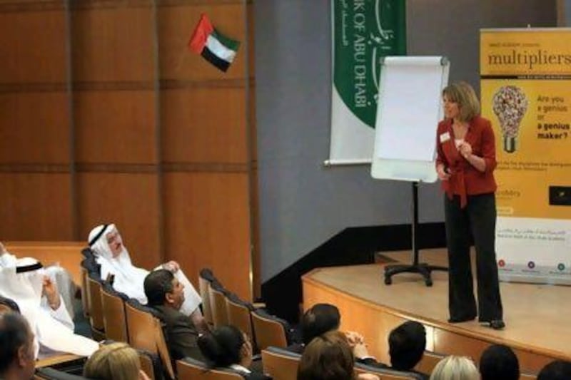 Liz Wiseman speaks to an audience of managers at the National Bank of Abu Dhabi.