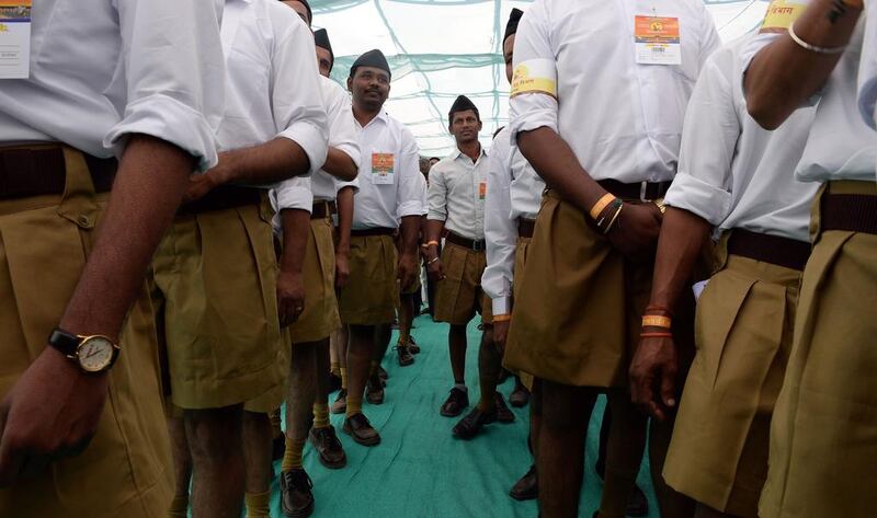 Volunteers from the Indian right-wing organisation Rashtriya Swayamsevak Sangh, or RSS, arrive for a massive rally in Pune on January 3, 2016. Indranil Mukherjee / AFP