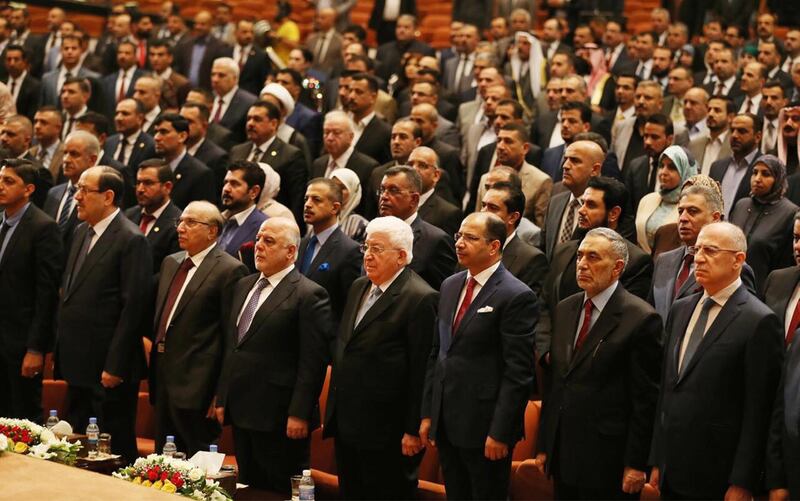 epa06994309 Iraqi Prime Minister Haidar al-Abadi (C-L) and Iraqi President Fuaad Masum (C-R) along with members of the new parliament during the first session in Baghdad, Iraq, 03 September 2018. Iraq's parliament convened its first session since it was elected in May, but failed to agree on potential candidates for the new prime minister and parliament speaker position.  EPA/STR