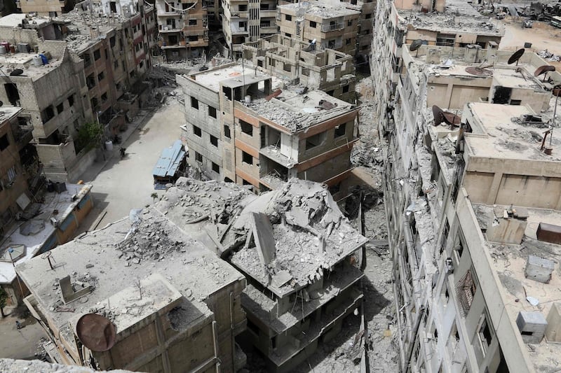 TOPSHOT - The former rebel Syrian town of Douma on the outskirts of Damascus is seen on April 17, 2018 after the Syrian army declared that all anti-regime forces have left Eastern Ghouta, following a blistering two month offensive on the rebel enclave. 
At the start of the year Eastern Ghouta was a sprawling semi-rural area just east of Damascus, home to almost 400,000 inhabitants, which had already endured several years under a government siege that slashed access to food, medicine and other goods. The Syrian government and allied forces launched a massive assault on February 18 to retake the enclave, which had been out of regime control since 2012.
 / AFP PHOTO / STRINGER