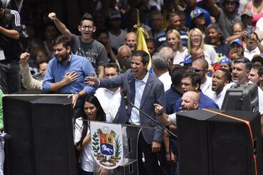 Juan Guaido has called on residents of poorer areas south of the capital to protest the regime's rules as power outages have virtually shut down the country. Bloomberg.