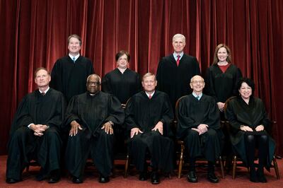 Members of the Supreme Court pose for a group photo at the Supreme Court in Washington, April 23, 2021. AP