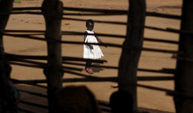 A South Sudanese refugee girl walks around the Bidi Bidi refugee camp in northern Uganda. Ben Curtis / AP Photo