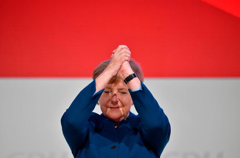 German Chancellor and leader of the Christian Democratic Union (CDU) Angela Merkel acknowledges the applause after delivering her speech at a party congress of Germany's conservative Christian Democratic Union (CDU) party at a fair hall in Hamburg, northern Germany. German Chancellor Angela Merkel will hand off leadership of her party after nearly two decades at the helm, with the race wide open between a loyal deputy and a longtime rival.  AFP