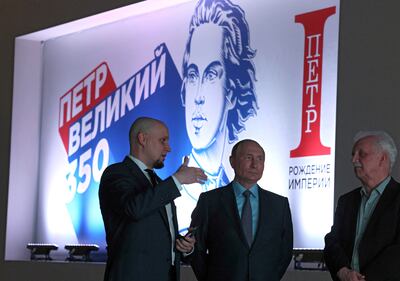 Russia's President Vladimir Putin listens to explanations as he visits an exhibition opened to mark the 350th birth anniversary of Russian tsar and the first Russian Emperor Peter the Great in Moscow. Reuters