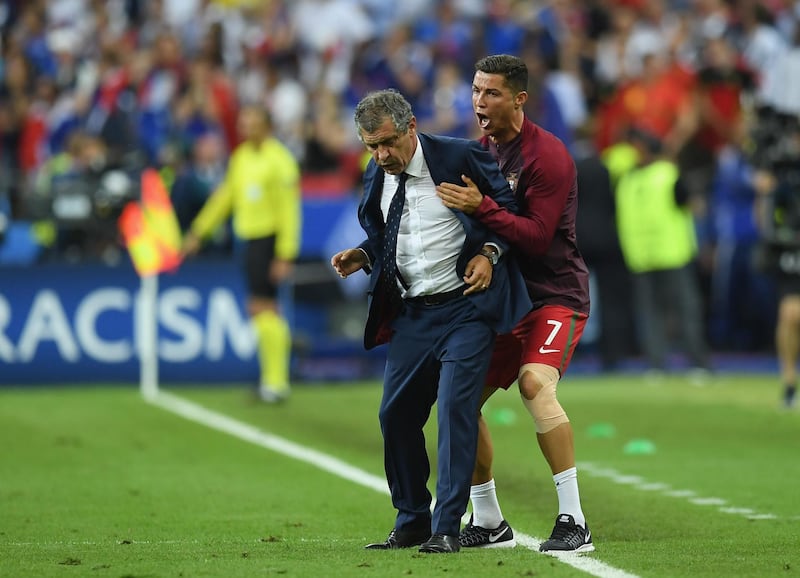 PARIS, FRANCE - JULY 10:  Manager Fernando Santos and Cristiano Ronaldo of Portugal celebrate winning at the final whistle during the UEFA EURO 2016 Final match between Portugal and France at Stade de France on July 10, 2016 in Paris, France.  (Photo by Matthias Hangst/Getty Images)