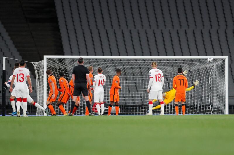 Turkey's forward Burak Yilmaz (L hidden) celebrates after scoring his team's fourth goal during the FIFA World Cup Qatar 2022 qualification Group G football match between Turkey and The Netherlands at the Ataturk Olympic Stadium, in Istanbul, on March 24, 2021.  / AFP / POOL / MURAD SEZER
