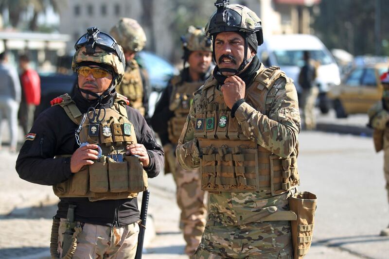 Iraqi security forces block streets leading to the Ministry of Higher Education as protesters gather nearby in the capital Baghdad on January 14, 2020. AFP