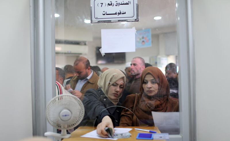 Palestinian Hamas-hired employees receive full salaries for the first time in years Gaza Strip. Reuters