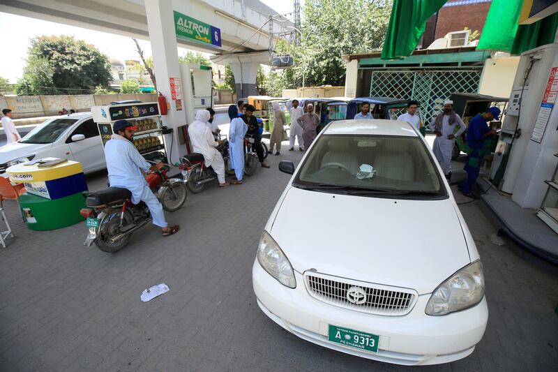 Queues at a fuel station in Peshawar. Pakistan has experienced lengthy power cuts over the past month.  EPA