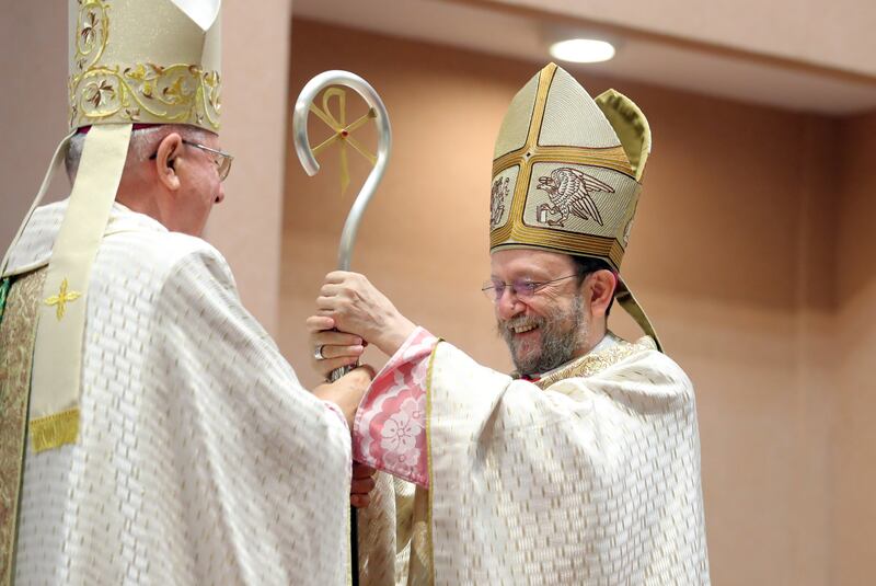 Italian Bishop Martinelli, right, is congratulated by Bishop Hinder at St Joseph's.