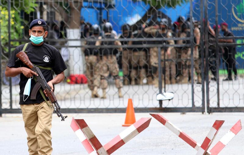 epa08515349 Pakistani security officials inspect the scene of an attack by banned militants outfit Baloch Liberation Army (BLA) at Karachi Stock Exchange in Karachi, Pakistan, 29 June 2020. According to media reports, at least six people, including attackers, were killed.  EPA/REHAN KHAN