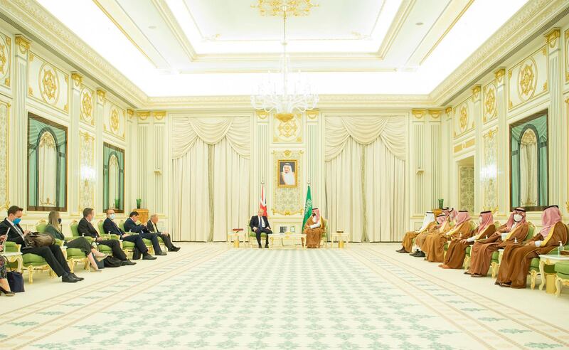 Prince Mohammed and Saudi officials meet Mr Johnson in Saudi Arabia.