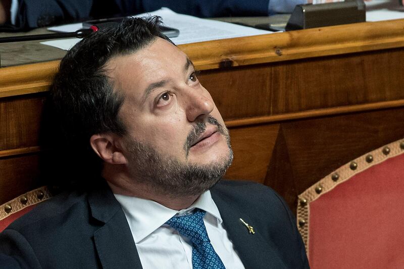 Matteo Salvini looks up as he sits in the Italian Senate in Rome, Wednesday, Feb. 12, 2020. The Italian Senate is deciding whether opposition populist leader Matteo Salvini should be prosecuted as he has demanded for allegedly holding migrants hostage aboard a coast guard ship when he was interior minister. (Roberto Monaldo/Lapresse via AP)