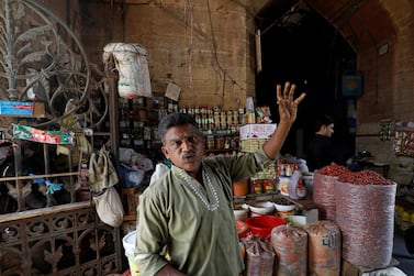 Mohammad Abbasi at his stall at the Empress Market in Karachi. Traders say business has been hit. Reuters
