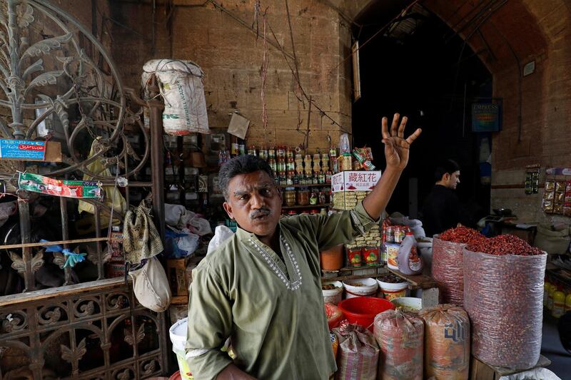 Mohammad Shakeel Abbasi, spice seller, gestures as he stands beside his makeshift stall at the British era Empress Market building after the removal of encroachments on the order of Supreme Court in Karachi, Pakistan March 27, 2019. Picture taken March 27, 2019. REUTERS/Akhtar Soomro