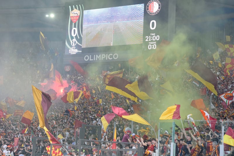 AS Roma supporters watch on maxi-screens. EPA