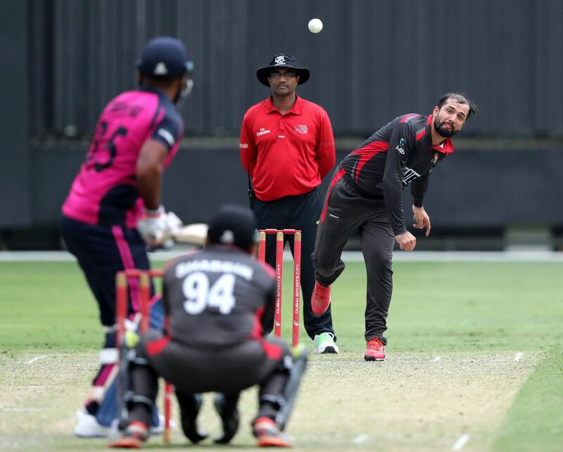 Dubai, United Arab Emirates - October 07, 2019: The UAE's Rohan Mustafa bowls during the warm up game between the UAE and Bermuda. Monday the 7th of October 2019. International Cricket Stadium, Dubai. Chris Whiteoak / The National