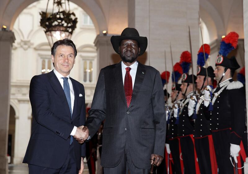 South Sudan President Salva Kiir Mayardit, center, and Italian Premier Giuseppe Conte, shake hands during a welcome ceremony at Chigi palace, Government's office, ahead of their meeting, Wednesday, April 10, 2019. The Vatican has invited South Sudanâ€™s president and opposition leader Riek Machar for a two-day spiritual retreat, attended also by Mayardit, meant to foster peace after the country's five-year civil war and build confidence in its fragile peace deal.  (AP Photo/Alessandra Tarantino)